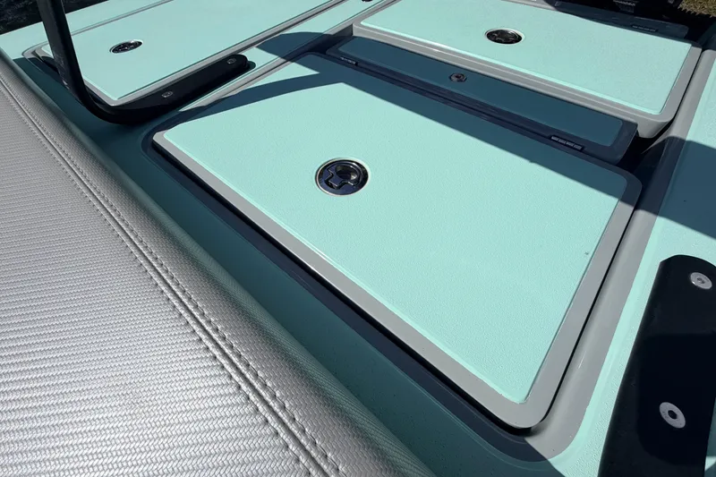 Slide: The Image of 2022 Chittum Skiffs Islamorada 21 boat deck with storage compartments. - 42