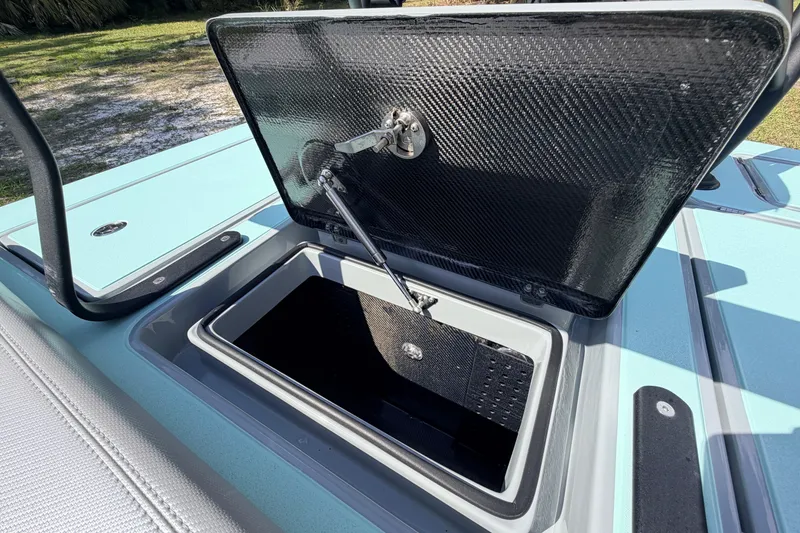 Slide: The Image of Open storage compartment on 2022 Chittum Skiffs Islamorada 21 boat. - 43