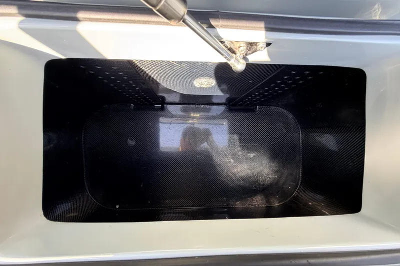 Slide: The Image of Interior view of a 2022 Chittum Skiffs Islamorada 21 storage compartment. - 44