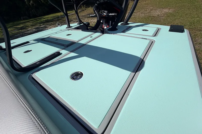 Slide: The Image of 2022 Chittum Skiffs Islamorada 21 deck with storage compartments, light blue finish. - 45