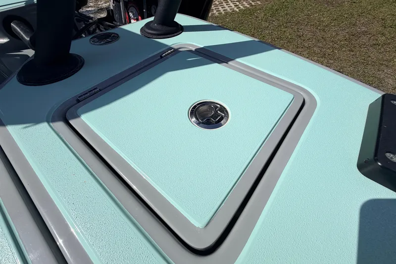 Slide: The Image of 2022 Chittum Skiffs Islamorada 21 deck hatch with sleek design and mint green finish. - 48