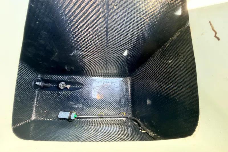 Slide: The Image of Carbon fiber compartment in 2022 Chittum Skiffs Islamorada 21 boat. - 50