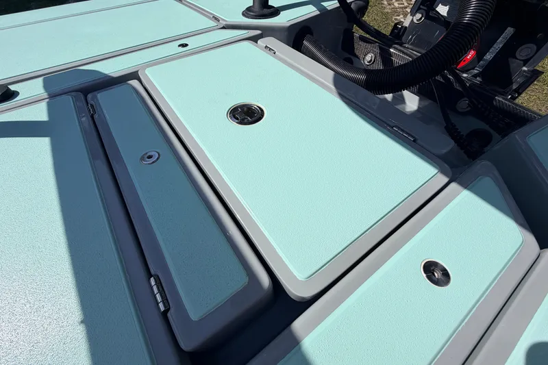 Slide: The Image of 2022 Chittum Skiffs Islamorada 21 boat deck with storage compartments. - 51