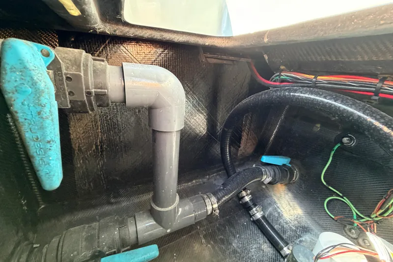 Slide: The Image of Interior view of 2022 Chittum Skiffs Islamorada 21, showcasing plumbing and wiring components. - 55