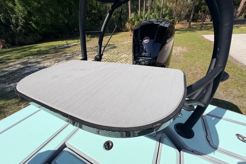 Slide: The Image of 2022 Chittum Skiffs Islamorada 21 with Mercury engine, featuring a sleek deck design. - 56