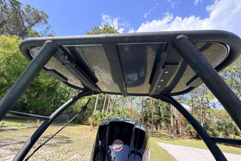 Slide: The Image of 2022 Chittum Skiffs Islamorada 21 boat with a sturdy T-top under a clear sky. - 60