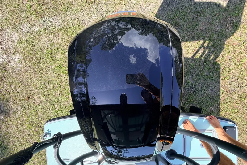 Slide: The Image of Overhead view of 2022 Chittum Skiffs Islamorada 21 boat with reflection and shadow. - 62