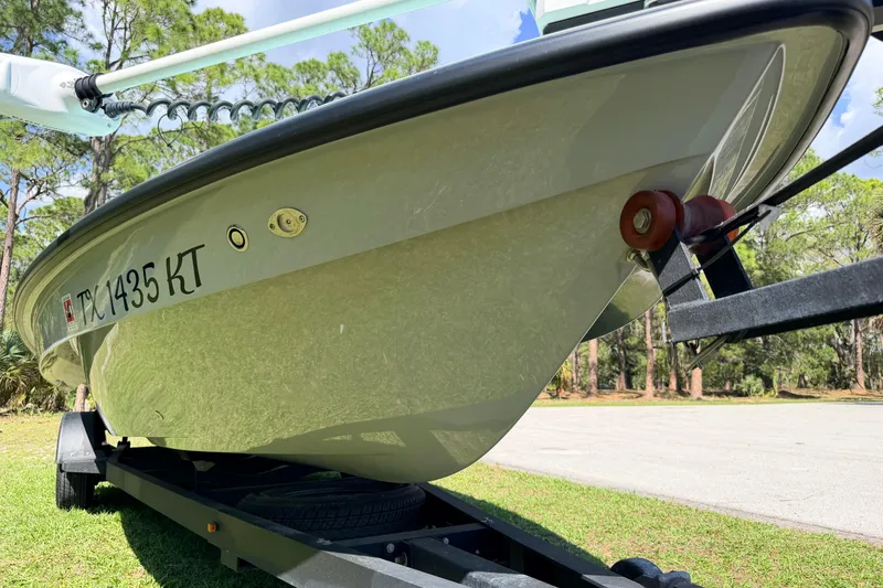 Slide: The Image of 2022 Chittum Skiffs Islamorada 21 boat on trailer, parked outdoors. - 67