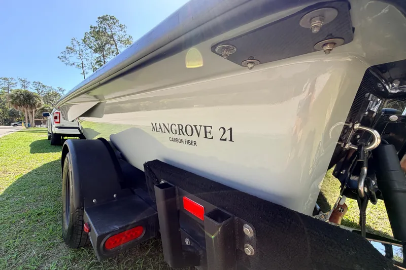 Slide: The Image of 2022 Chittum Skiffs Islamorada 21 boat on trailer, featuring carbon fiber construction. - 73