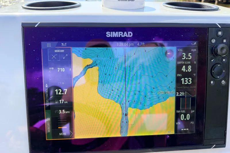 Slide: The Image of Simrad navigation display on 2022 Chittum Skiffs Islamorada 21, showing depth and speed data. - 80