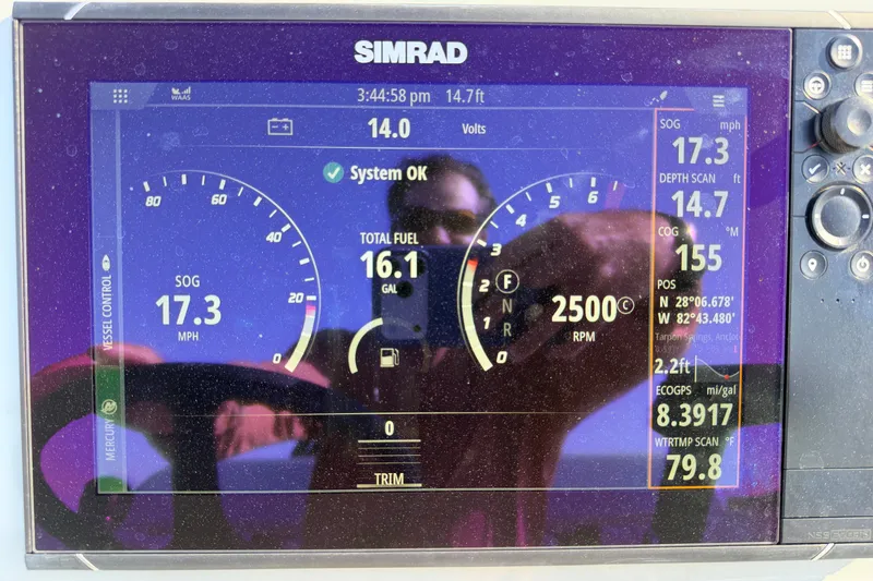 Slide: The Image of Simrad display on 2022 Chittum Skiffs Islamorada 21 showing speed, fuel, and navigation data. - 81