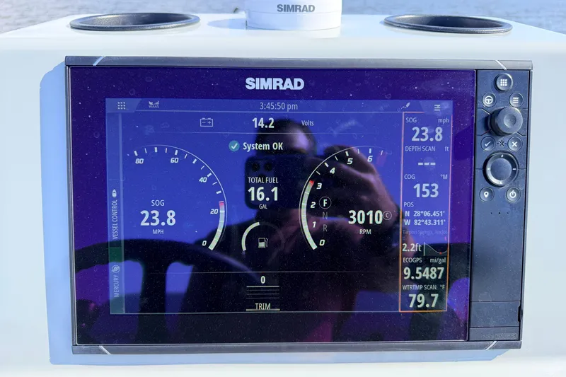 Slide: The Image of Simrad display on 2022 Chittum Skiffs Islamorada 21 showing speed, fuel, and navigation data. - 82