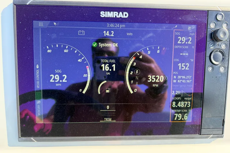 Slide: The Image of Simrad display on 2022 Chittum Skiffs Islamorada 21 showing speed, fuel, and navigation data. - 83