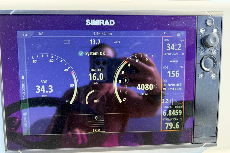 Slide: The Image of Simrad display on 2022 Chittum Skiffs Islamorada 21 showing speed, fuel, and navigation data. - 84