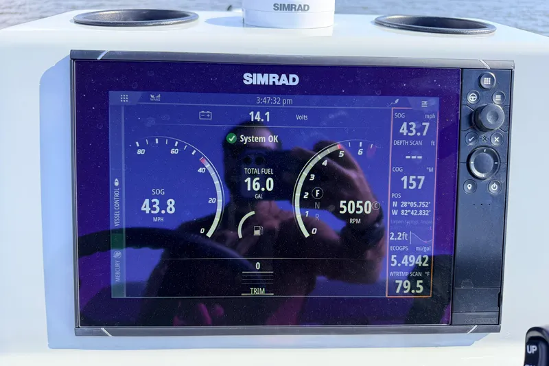 Slide: The Image of Simrad display on 2022 Chittum Skiffs Islamorada 21 showing speed, fuel, and navigation data. - 86