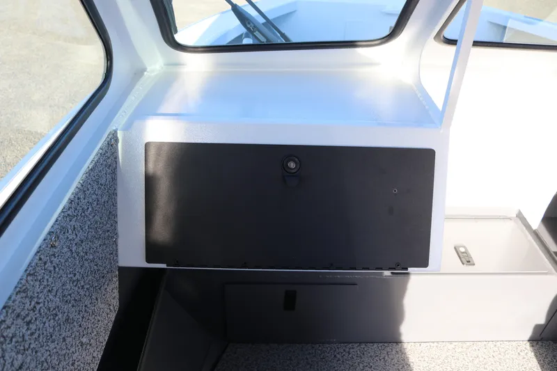 Slide: The Image of Interior view of 2026 Alumaweld Stryker 202 boat, featuring a storage compartment. - 11