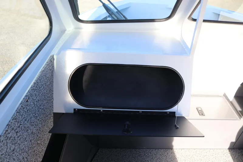 Slide: The Image of 2026 Alumaweld Stryker 202 boat interior with open storage compartment. - 12