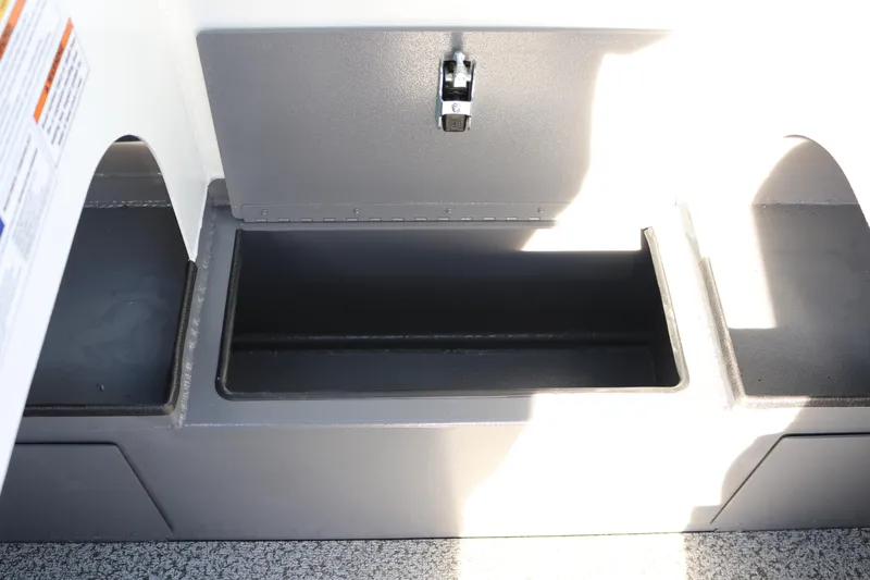Slide: The Image of Storage compartment in 2026 Alumaweld Stryker 202 boat, featuring a secure latch. - 14