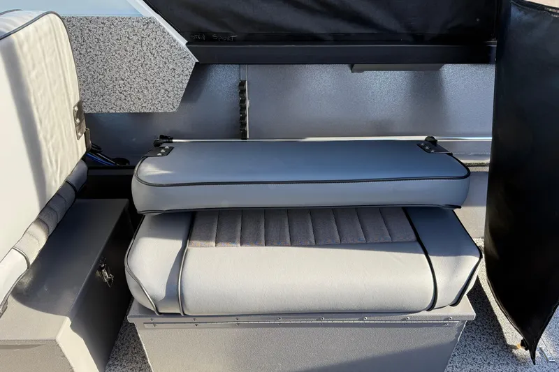 Slide: The Image of 2026 Alumaweld Stryker 202 boat interior with gray cushioned seating. - 21