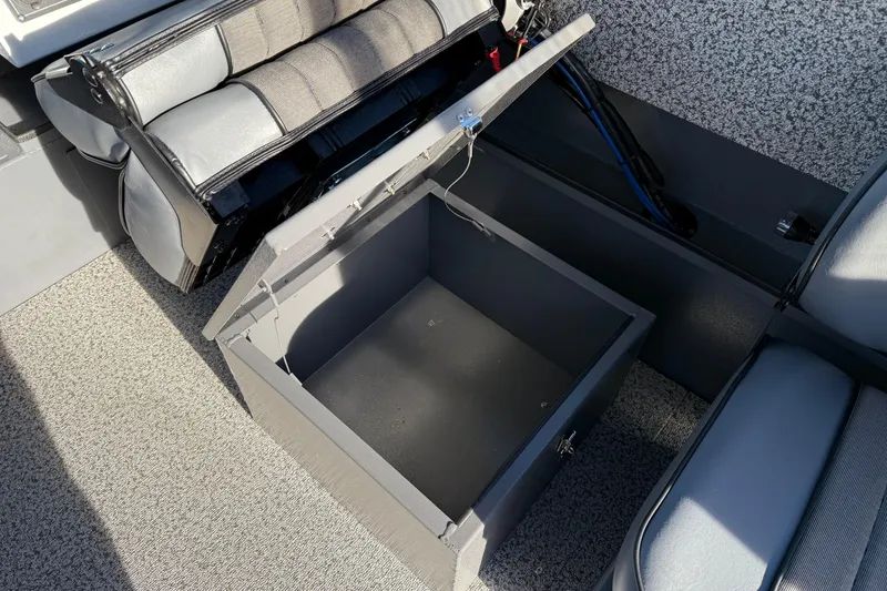 Slide: The Image of Open storage compartment in 2026 Alumaweld Stryker 202 boat interior. - 24