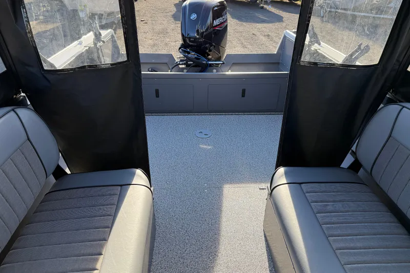 Slide: The Image of 2026 Alumaweld Stryker 202 boat interior with seating and Mercury outboard motor. - 27
