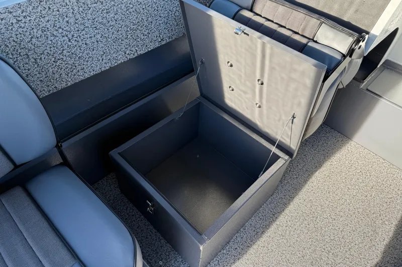Slide: The Image of Open storage compartment in 2026 Alumaweld Stryker 202 boat interior. - 28