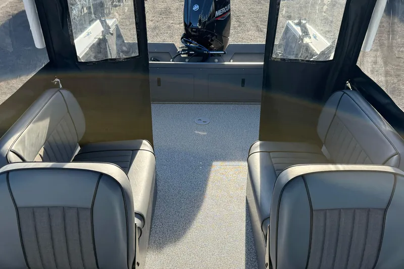 Slide: The Image of 2026 Alumaweld Stryker 202 boat interior with seating and Mercury engine. - 31