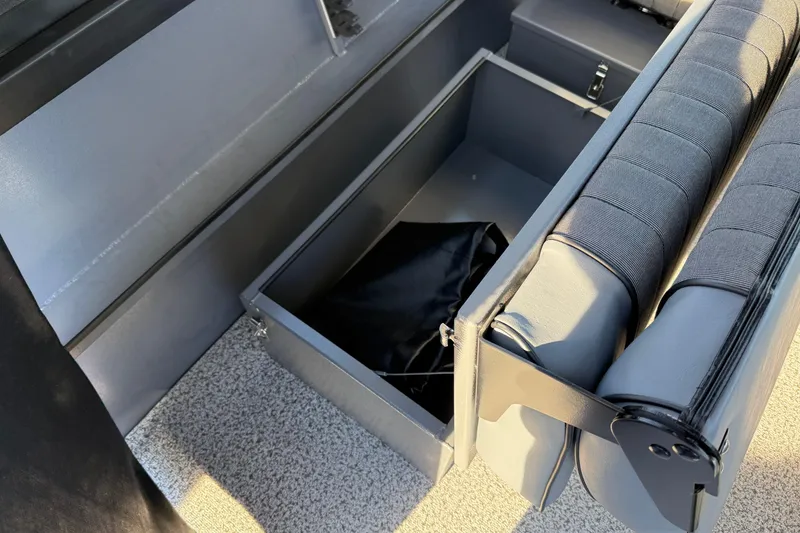 Slide: The Image of Interior storage compartment of 2026 Alumaweld Stryker 202 boat with cushioned seating. - 34