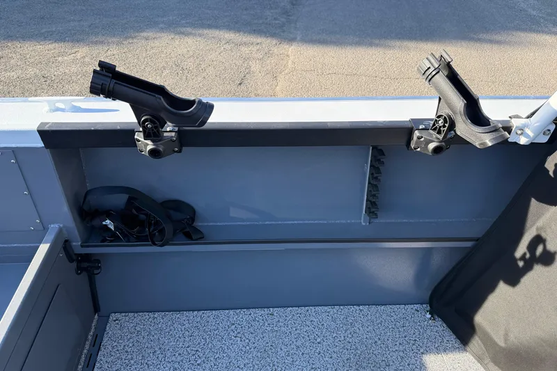Slide: The Image of 2026 Alumaweld Stryker 202 boat interior with rod holders and storage compartment. - 36