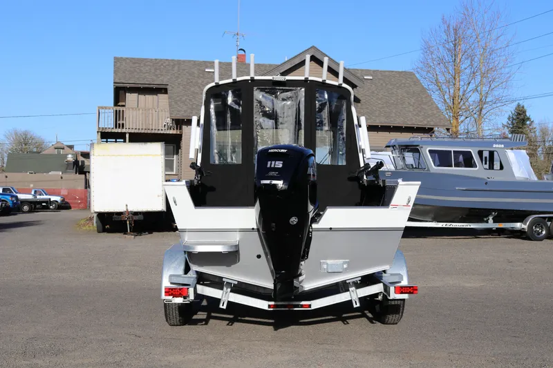 Slide: The Image of 2026 Alumaweld Stryker 202 boat on trailer, rear view with Mercury engine. - 4