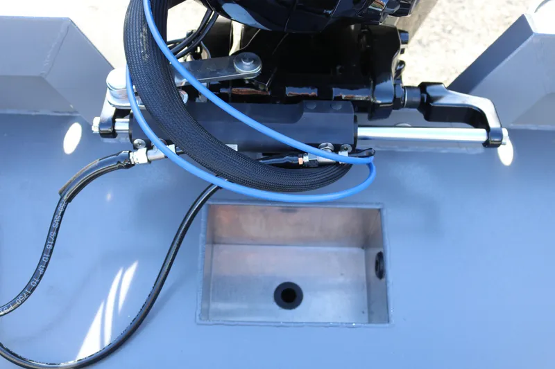 Slide: The Image of 2026 Alumaweld Stryker 202 boat engine compartment with visible cables and components. - 5