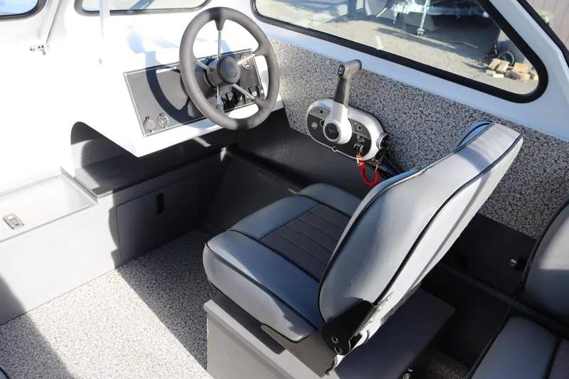 Slide: The Image of Interior of 2026 Alumaweld Stryker 202 boat with steering wheel and control panel. - 9