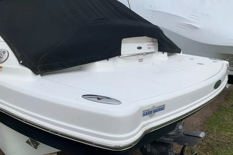 Slide: The Image of 2008 Chaparral Sunesta 224 boat with black cover, rear view. - 10