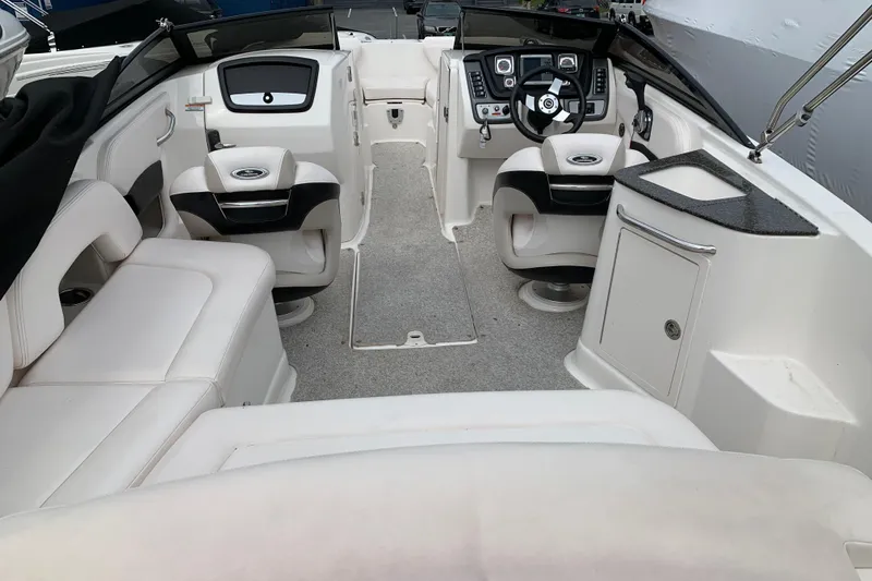 Slide: The Image of Interior of a 2008 Chaparral Sunesta 224 boat with seating and helm. - 13