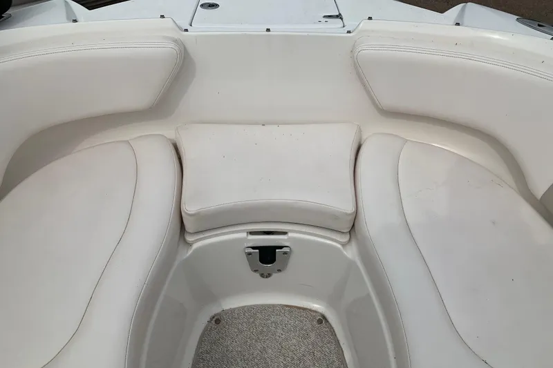 Slide: The Image of Interior seating of 2008 Chaparral Sunesta 224 boat, featuring white cushioned seats. - 25