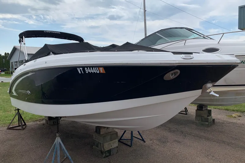 The Image of 2008 Chaparral Sunesta 224 boat on stands, covered, with registration number visible. - 4