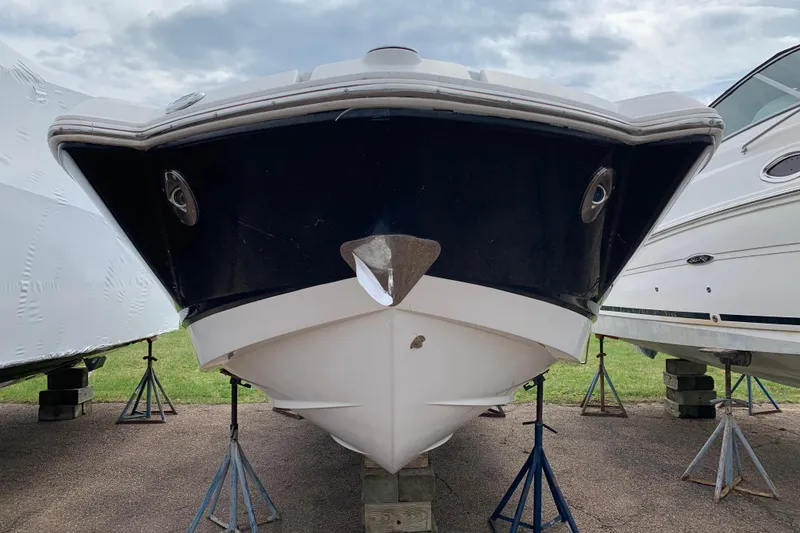Slide: The Image of 2008 Chaparral Sunesta 224 boat on stands, front view, outdoors. - 6