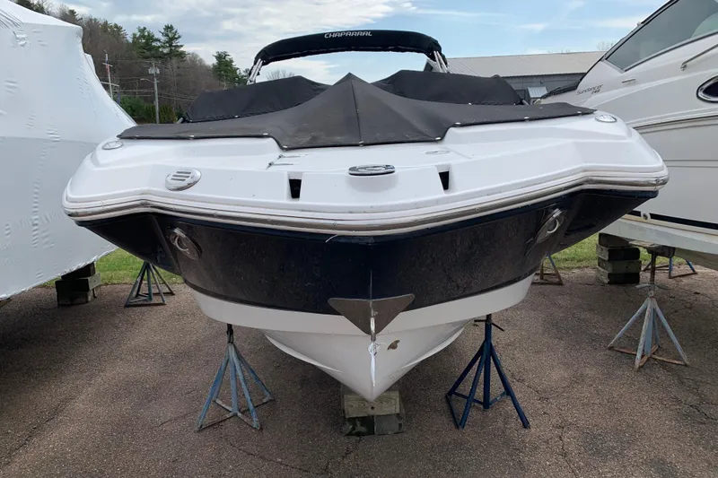 Slide: The Image of 2008 Chaparral Sunesta 224 boat on stands, covered and stored outdoors. - 7