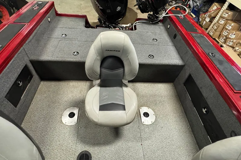 Slide: The Image of 2019 Tracker Targa V-18 WT boat interior with gray seating and red accents. - 10