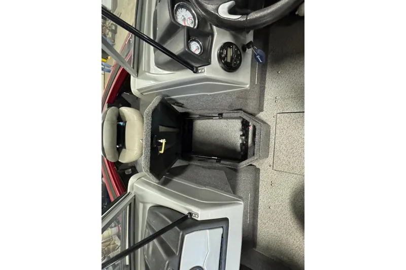 Slide: The Image of 2019 Tracker Targa V-18 WT boat interior with steering wheel and dashboard controls. - 14