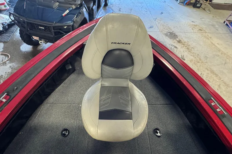 Slide: The Image of 2019 Tracker Targa V-18 WT boat seat in a garage setting. - 15