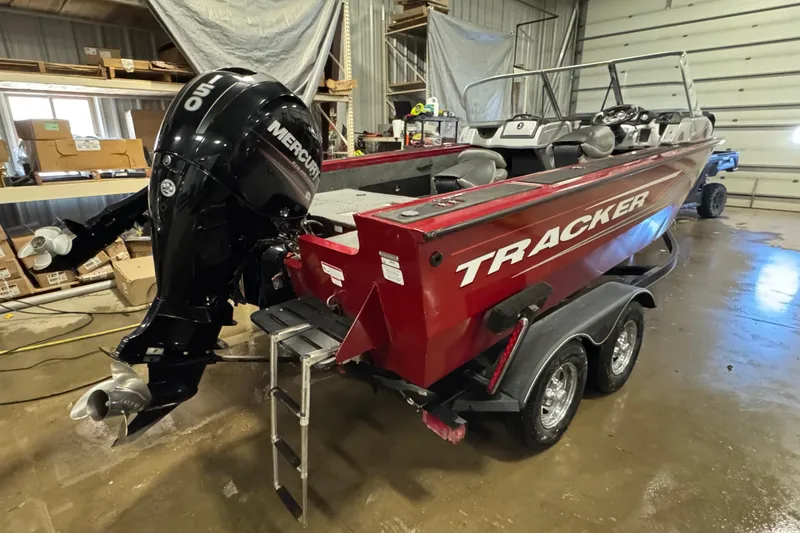 Slide: The Image of 2019 Tracker Targa V-18 WT boat with Mercury outboard motor in a garage. - 3