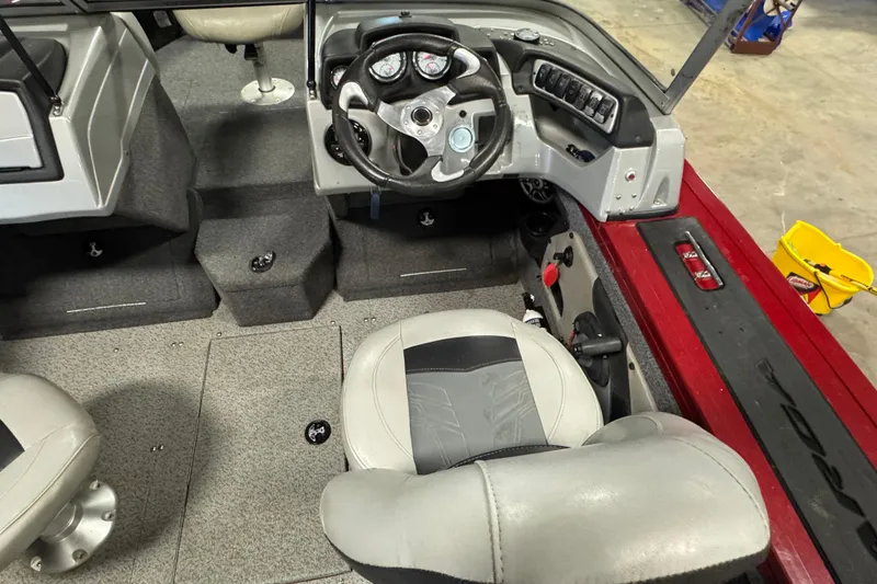 Slide: The Image of 2019 Tracker Targa V-18 WT boat interior with steering wheel and seating. - 6