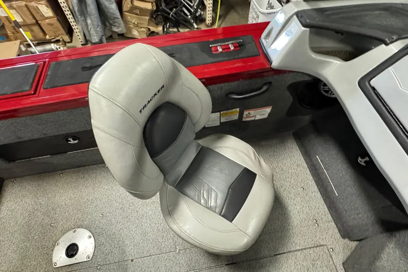 Slide: The Image of 2019 Tracker Targa V-18 WT boat interior with gray seat and red accents. - 8