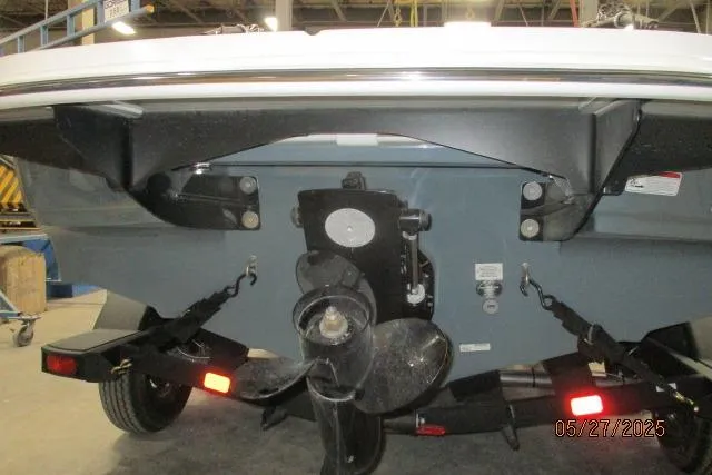 Slide: The Image of Rear view of 2025 Tahoe 210 Si boat with propeller and trailer. - 16