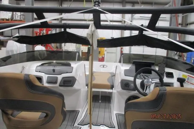 Slide: The Image of Interior view of 2025 Tahoe 210 Si boat with modern dashboard and seating. - 2