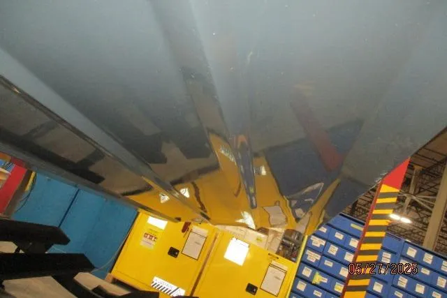 Slide: The Image of Underneath view of a 2025 Tahoe 210 Si boat in a storage facility. - 20