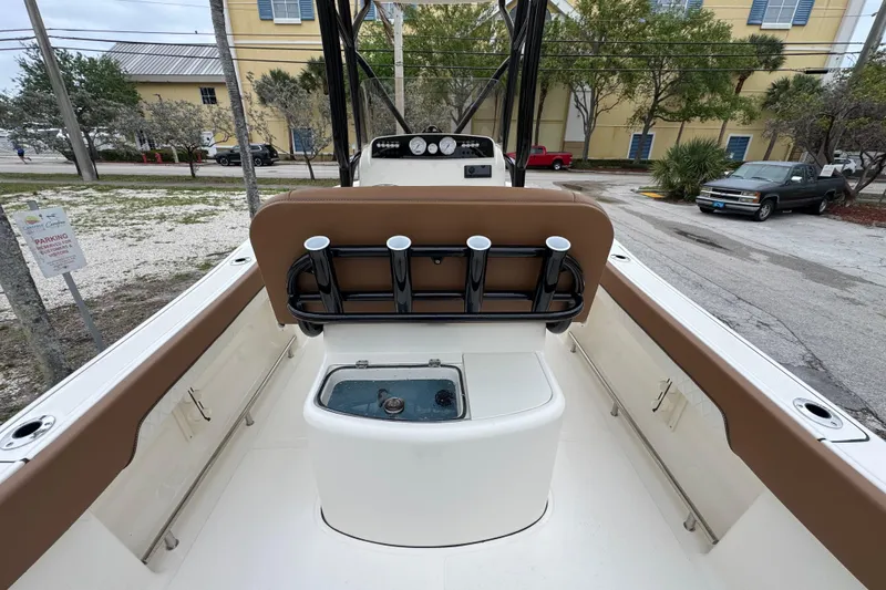 Slide: The Image of 2026 Pioneer 202 Sportfish boat interior with rod holders and seating. - 6