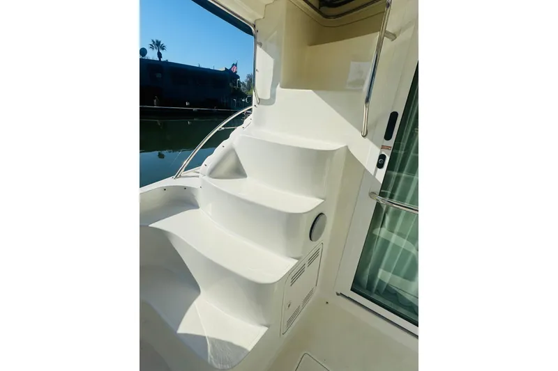 Slide: The Image of Staircase on a 2000 Sea Ray 400 Sedan Bridge yacht, leading to upper deck. - 14