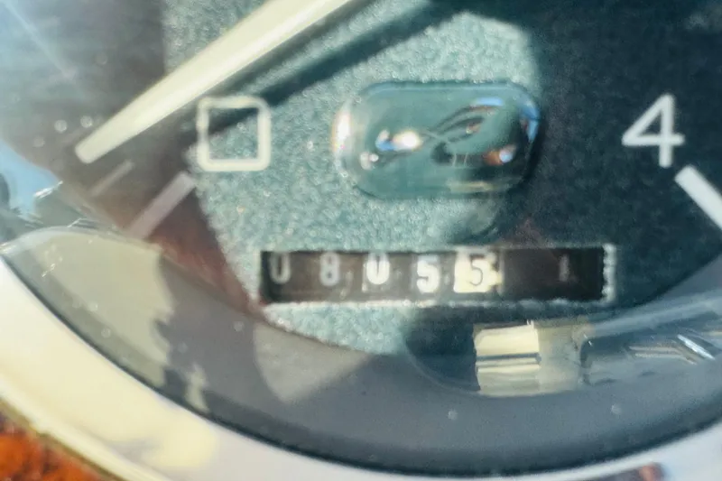 Slide: The Image of Close-up of a 2000 Sea Ray 400 Sedan Bridge gauge displaying 8055 hours. - 25